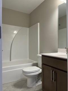 full bathroom with toilet, vanity, and washtub / shower combination