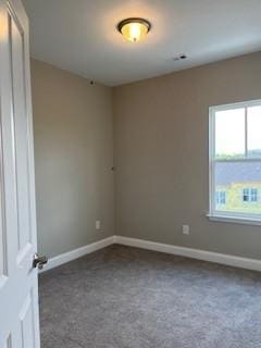 unfurnished room featuring carpet flooring