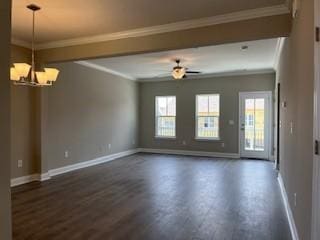 spare room featuring ceiling fan with notable chandelier, crown molding, and dark wood-type flooring