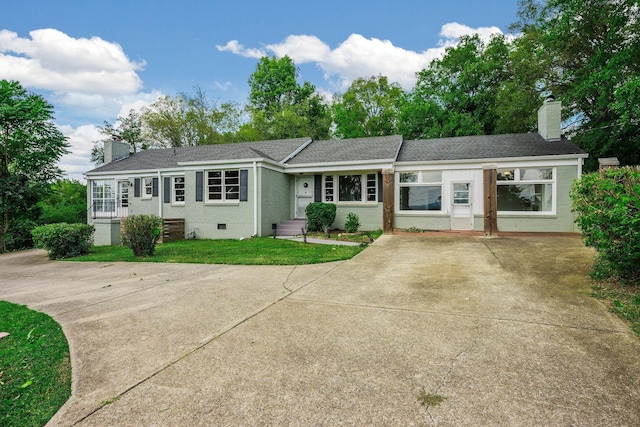 ranch-style house with a front yard