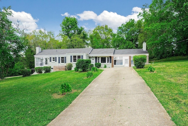 ranch-style home with a front lawn