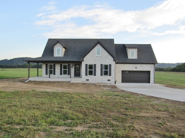 view of front of home featuring a front lawn and covered porch