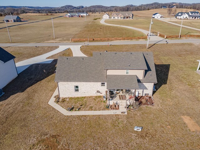 birds eye view of property with a mountain view