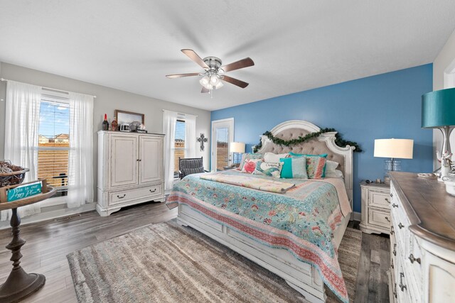 bedroom featuring dark wood-type flooring and ceiling fan