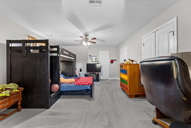 carpeted bedroom featuring ceiling fan