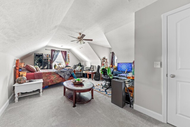 carpeted living room featuring ceiling fan, lofted ceiling, and a textured ceiling