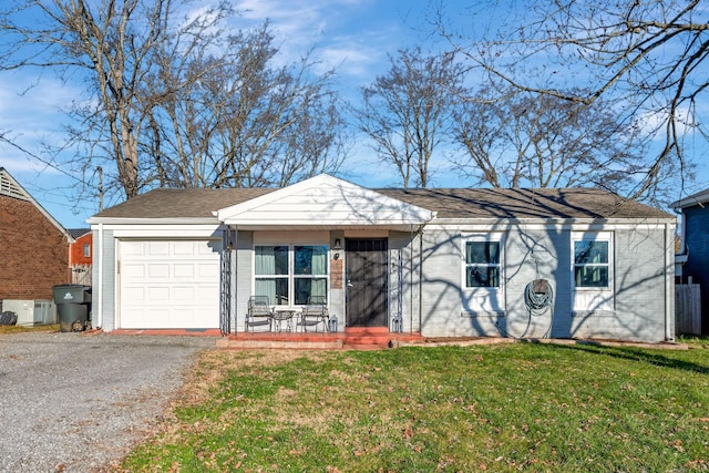 view of front of property with a front lawn and a garage