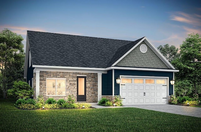 view of front of home featuring a lawn and a garage