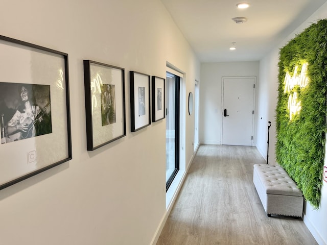 hall with light hardwood / wood-style floors