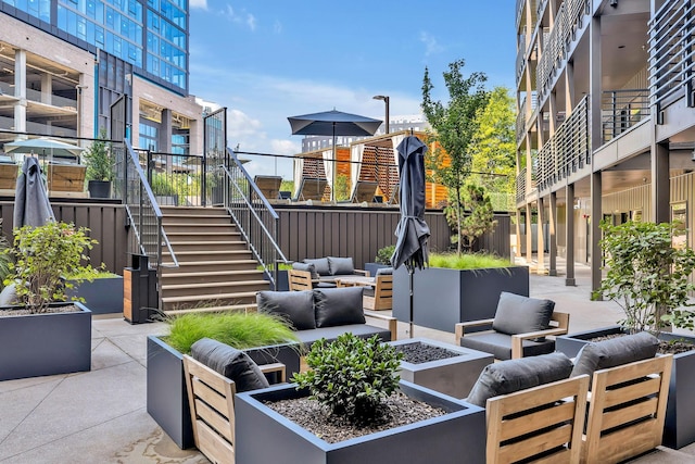 view of patio / terrace with an outdoor living space with a fire pit