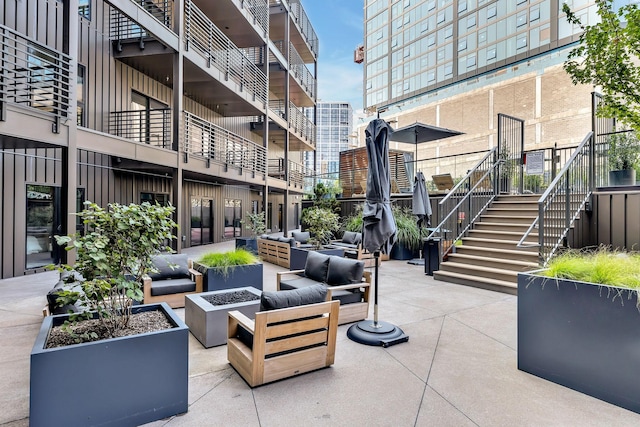 exterior space with an outdoor living space with a fire pit