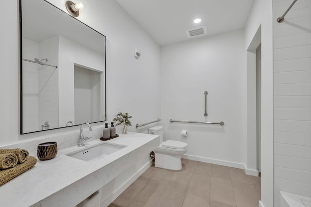 bathroom with toilet, sink, and walk in shower