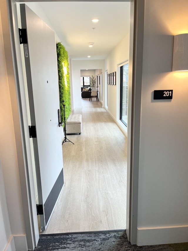 hallway featuring light hardwood / wood-style floors