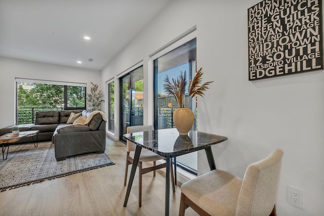 dining room with light hardwood / wood-style floors