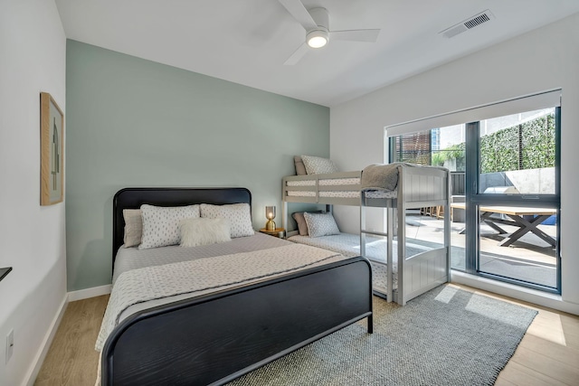 bedroom with ceiling fan and light hardwood / wood-style floors