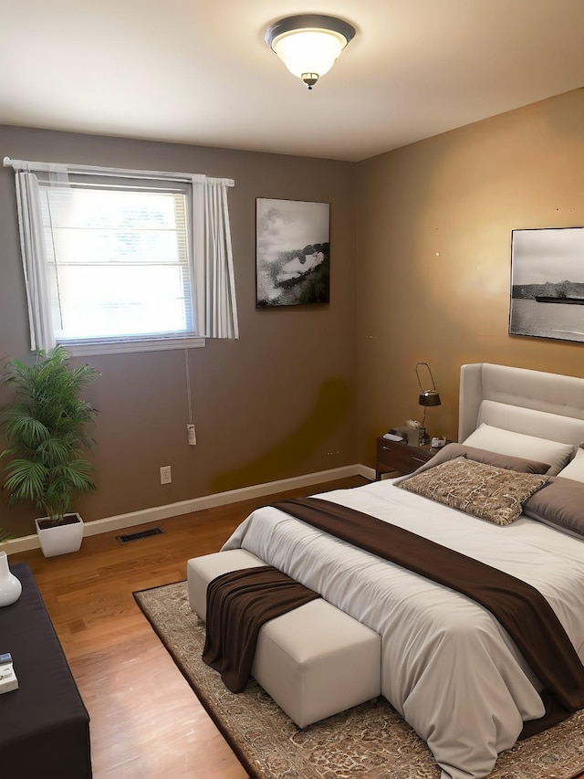 bedroom featuring wood-type flooring