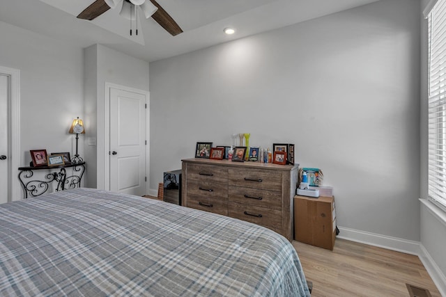 bedroom featuring ceiling fan and light hardwood / wood-style floors