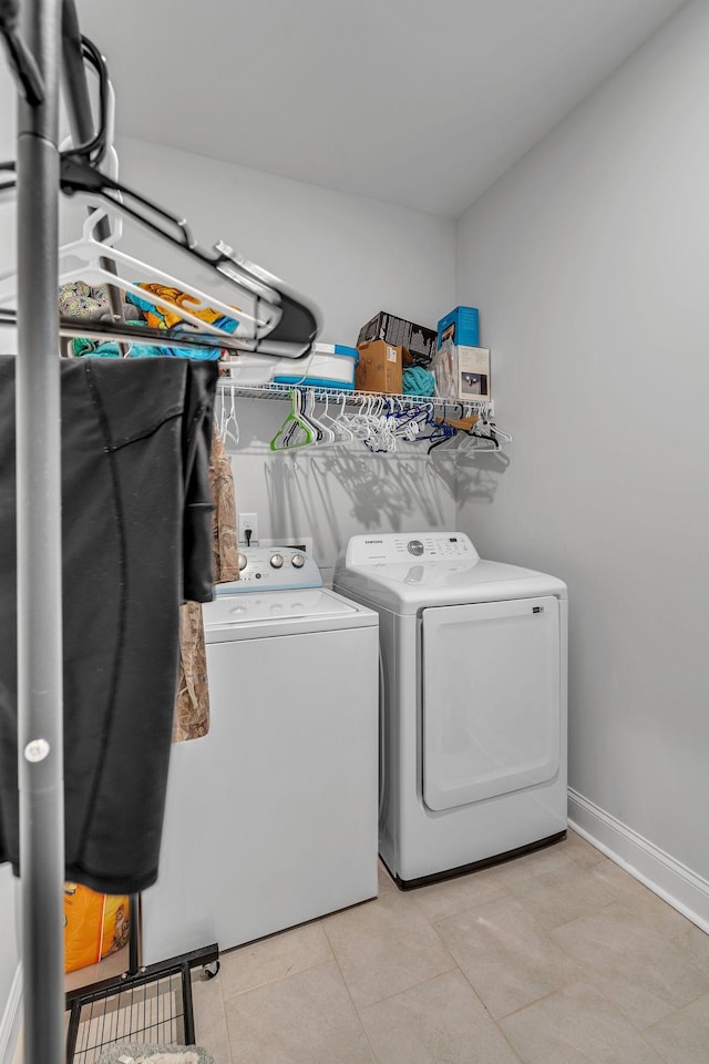 washroom featuring light tile patterned flooring and separate washer and dryer