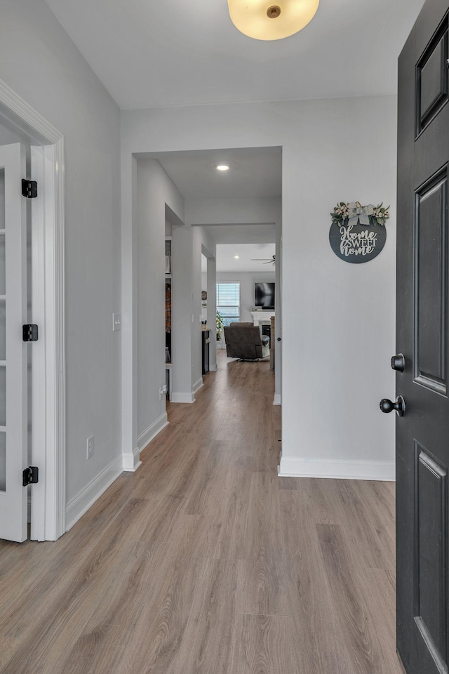 entrance foyer featuring light hardwood / wood-style flooring and ceiling fan