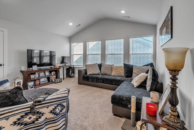 carpeted living room featuring lofted ceiling