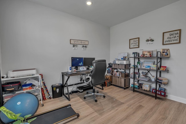 office with light hardwood / wood-style flooring