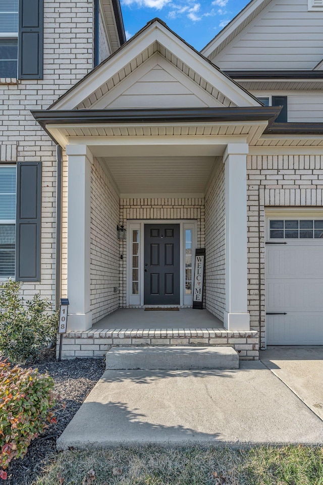 doorway to property featuring covered porch