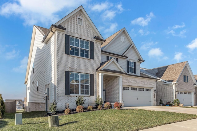 view of front of home with a garage and a front lawn