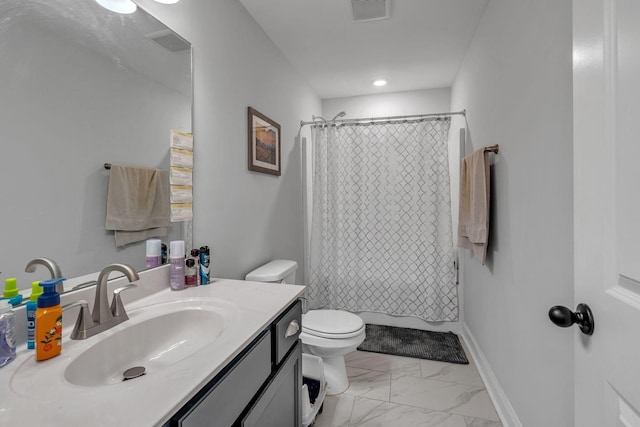 bathroom with vanity, toilet, and walk in shower