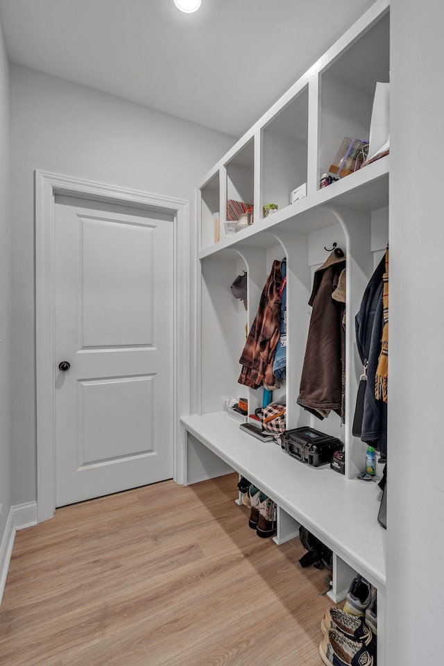 mudroom with light hardwood / wood-style flooring