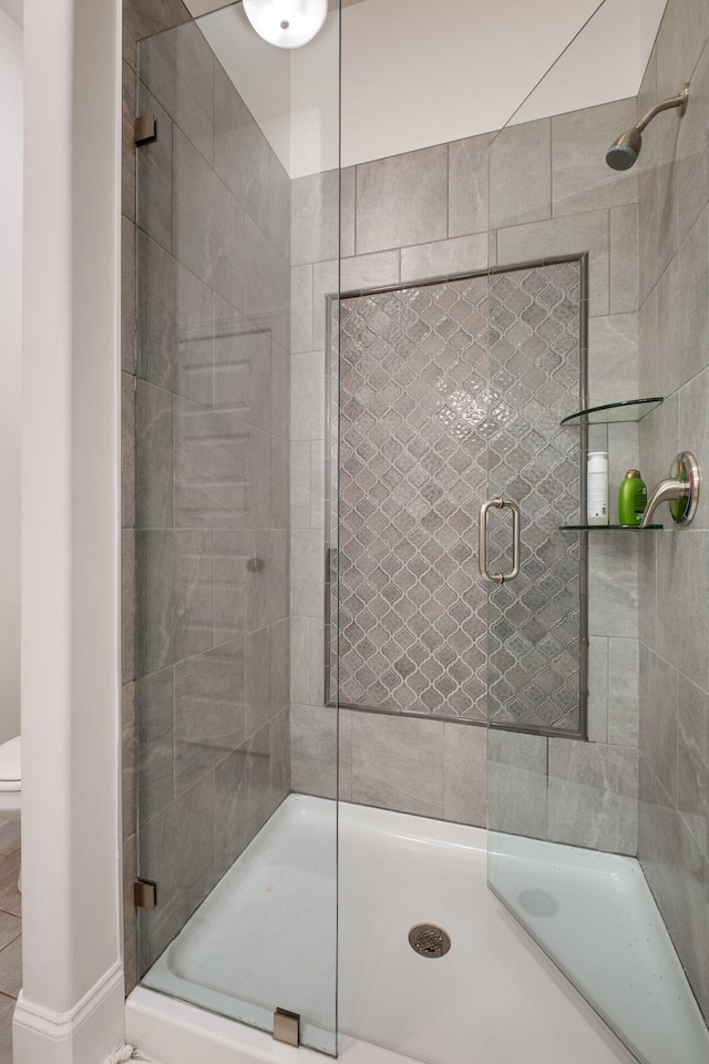 bathroom featuring an enclosed shower