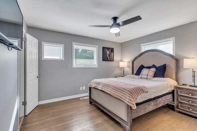 bedroom featuring ceiling fan and dark hardwood / wood-style flooring