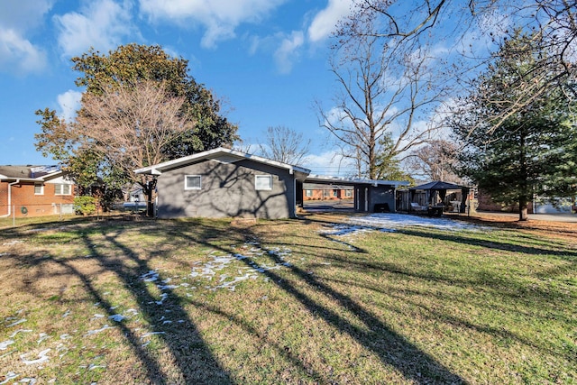 exterior space with a front yard and a gazebo