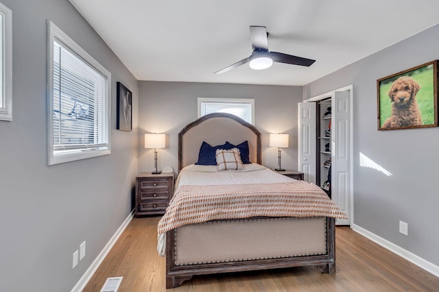 bedroom with hardwood / wood-style flooring and ceiling fan