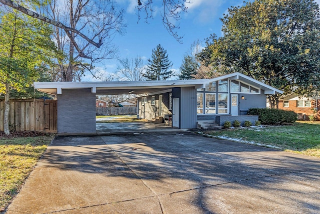 ranch-style house with a carport