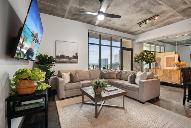 living room with concrete flooring and ceiling fan