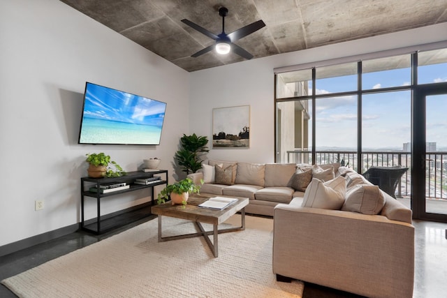 living room with ceiling fan and a healthy amount of sunlight