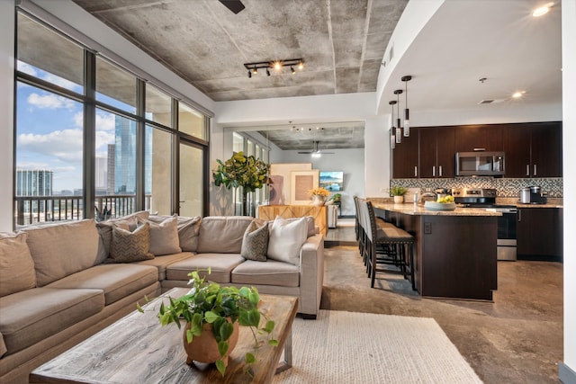 living room featuring ceiling fan