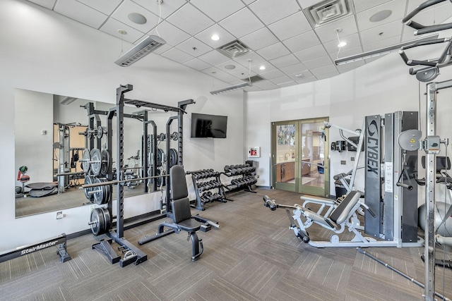 1510 Demonbreun St Unit 1007, Nashville, TN 37203 - gym featuring a paneled ceiling, a high ceiling, carpet floors, and french doors