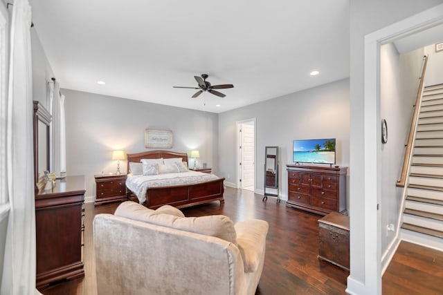 bedroom with dark hardwood / wood-style floors and ceiling fan