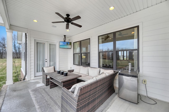 view of patio featuring outdoor lounge area, french doors, and ceiling fan