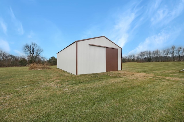 view of outdoor structure with a lawn