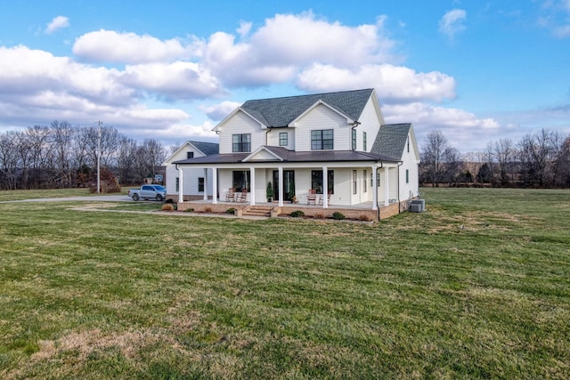 view of front of property with covered porch, central AC unit, and a front lawn