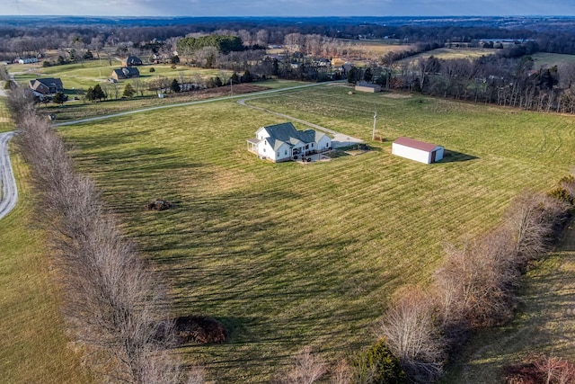 birds eye view of property featuring a rural view