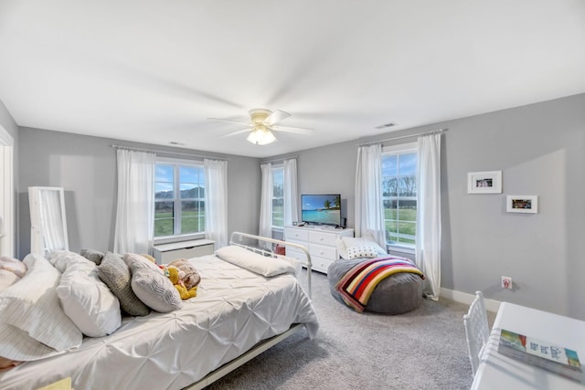 carpeted bedroom featuring ceiling fan