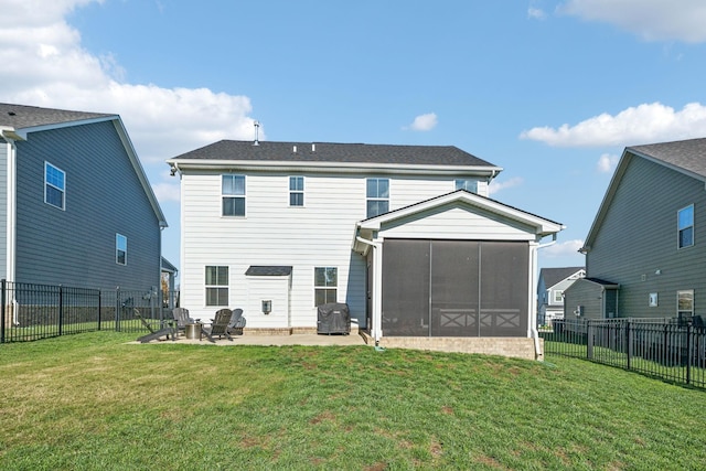 rear view of property with a sunroom, a fire pit, a yard, central AC, and a patio