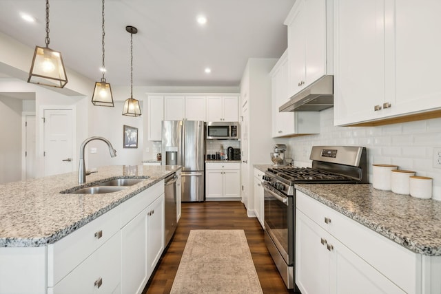 kitchen featuring white cabinets, sink, a kitchen island with sink, and stainless steel appliances