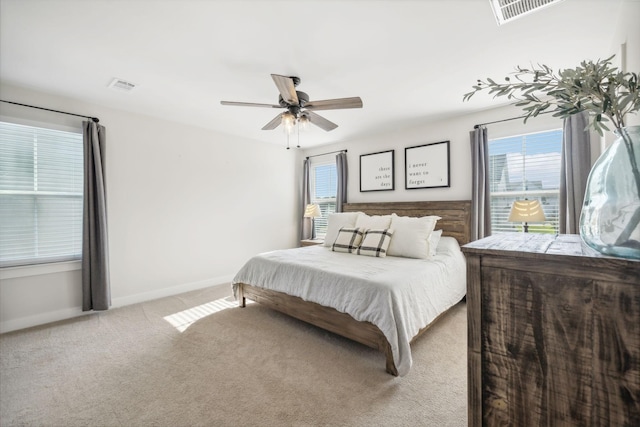 bedroom featuring ceiling fan and light carpet