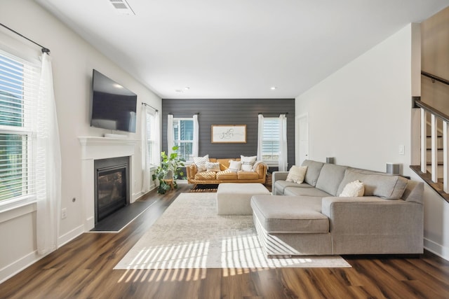 living room featuring dark wood-type flooring