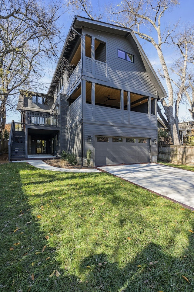 view of front facade with a garage and a front lawn