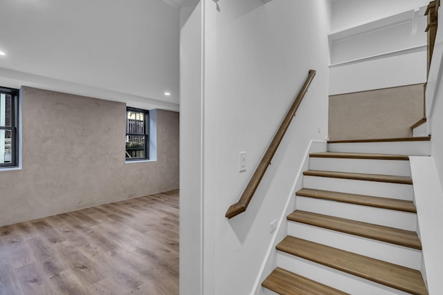 staircase with wood-type flooring